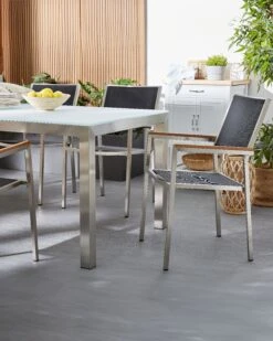 Conjunto De 4 Sillas De Jardín De Poliéster/acero Negro/plateado/madera Clara GROSSETO 10 Conjunto De 4 Sillas De Jardín De Poliéster/acero Negro/plateado/madera Clara GROSSETO -Beliani undef src sa picid 818420 type color image